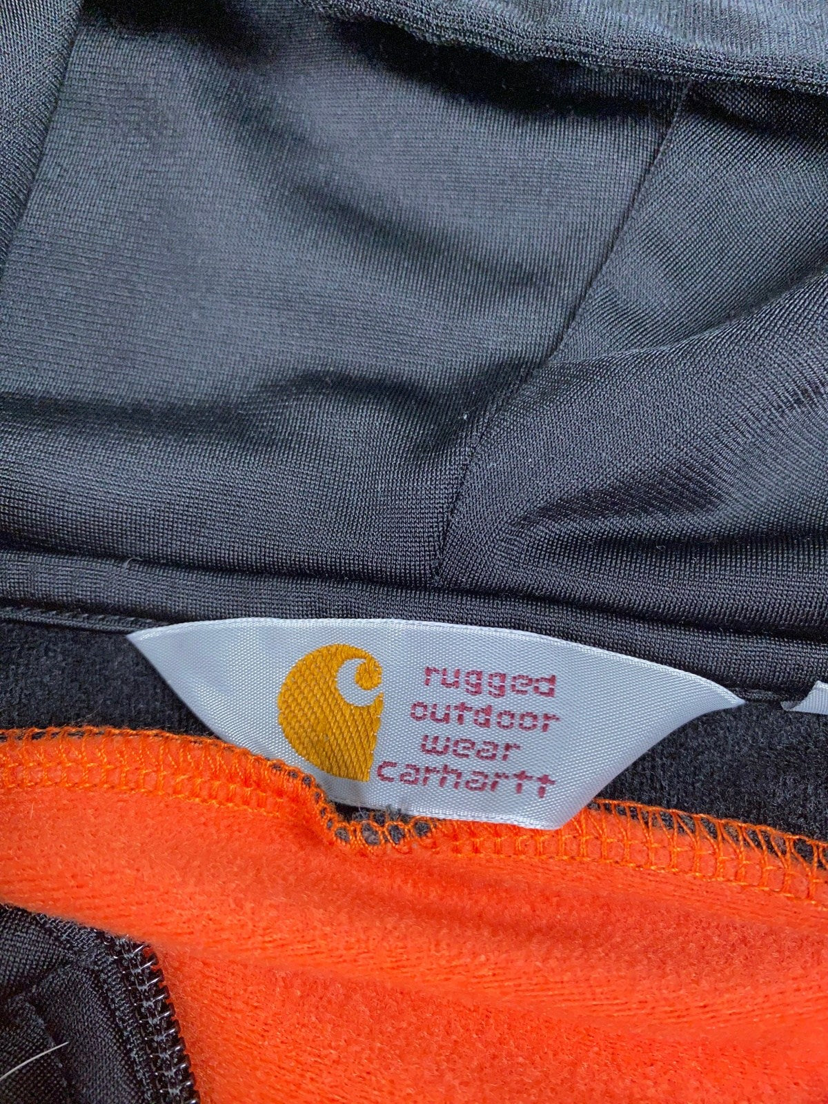 Vintage Carhartt Kapuzenjacke Orange/Schwarz M - Leichte Lockere Damen Jacke Vintage Klamotten, Secondhand Klamotten, Retro Mode, Nachhaltige Mode, Einzigartige Stücke, Zeitlose Mode, Umweltfreundliche Kleidung, Stilvolle Secondhand Mode, Hochwertige Vintage Kleidung